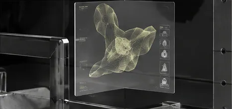 A citron wireframe form suspended inside a glass panel.