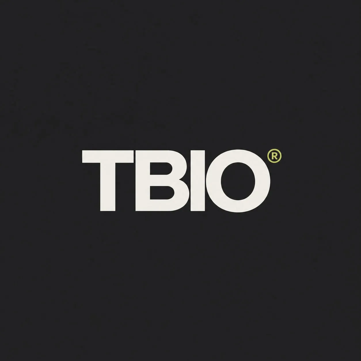 The TBIO wordmark in Chalk on Carbon with a citron registered mark.